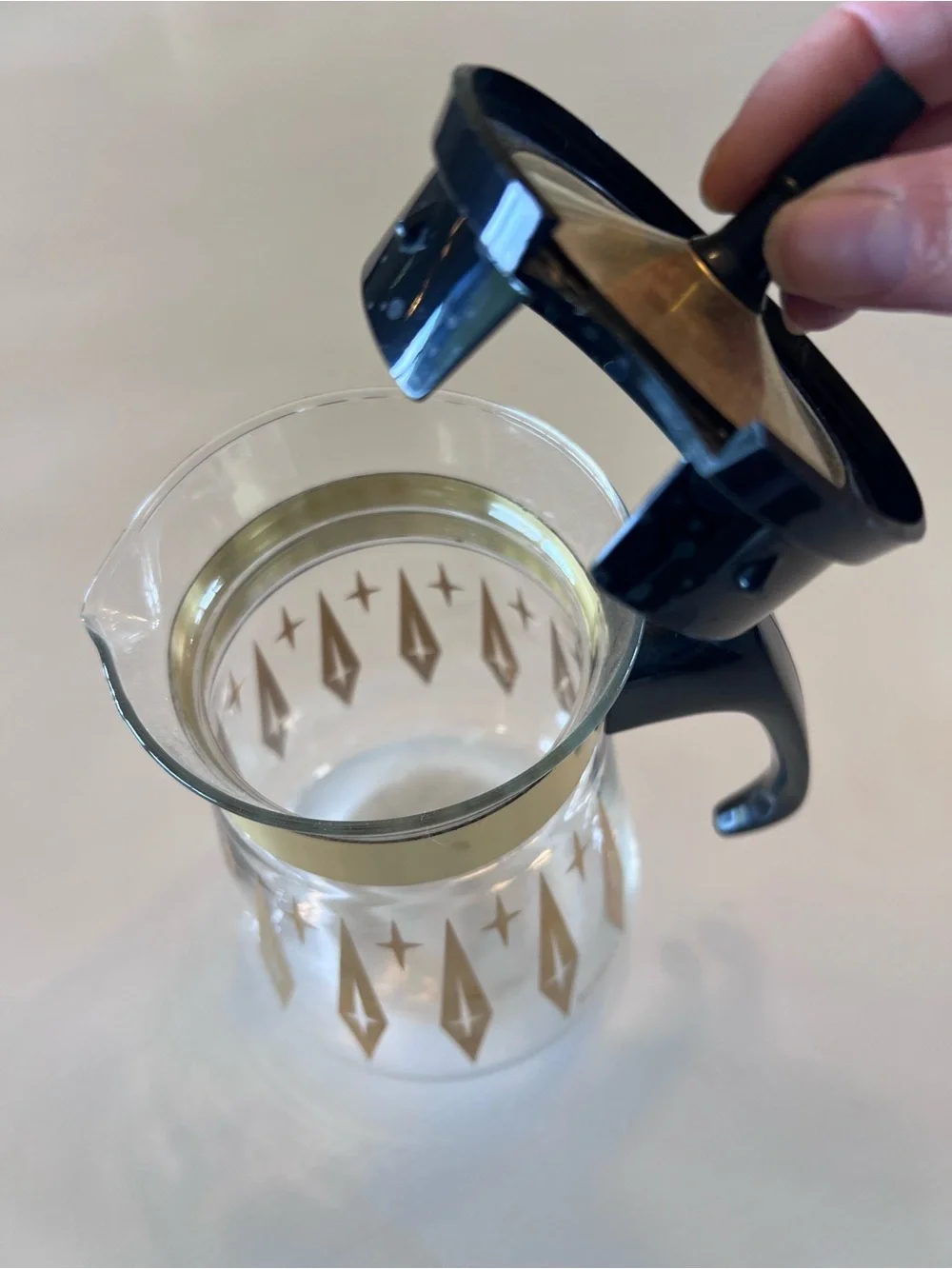 Pyrex Clear Glass Coffee Carafe with Gold Starburst Pattern and Black Handle